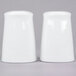 Two white ceramic salt and pepper shakers with a lid.