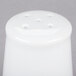 A white porcelain salt shaker with holes.