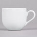 A white porcelain 10 Strawberry Street espresso cup with a handle on a saucer.