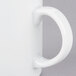 A close-up of a 10 Strawberry Street Classic White porcelain mug with a white handle.