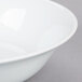 A close-up of a 10 Strawberry Street Classic White porcelain vegetable bowl with a white rim.