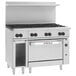 A large stainless steel Wolf commercial gas range on a counter.