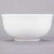 A white 10 Strawberry Street small oval porcelain rice bowl.
