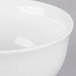 A close-up of a white 10 Strawberry Street small oval porcelain rice bowl.