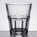 An Arcoroc clear glass with a patterned rim.