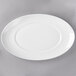 A white porcelain platter with a white rim.