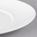 A close up of a 10 Strawberry Street white porcelain platter with a white rim.