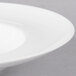 A close up of a white 10 Strawberry Street Ricard porcelain soup bowl with a rim.