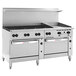 A Wolf stainless steel commercial gas range with 8 burners, a griddle, and 2 ovens.