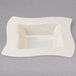 A white square Fineline bowl with a wavy edge.