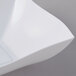 A close-up of a white Fineline Wavetrends serving bowl with a curved edge.