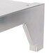 A Wolf stainless steel reinforced high shelf with metal brackets.