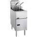 A Pitco stainless steel commercial floor fryer with two baskets.