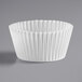 A close-up of a white Hoffmaster fluted baking cup.