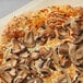 A pizza with mushrooms on top.
