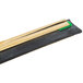 A black and gold rectangular object with a gold and green plastic tube.