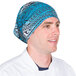 A chef wearing a blue Headsweats bandana with a tribal design.