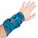 A hand with a blue fabric Headsweats wristband.