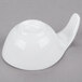 An Arcoroc white porcelain spoon on a white surface.