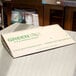 A GreenBox pizza box on a counter.