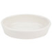 An ivory oval baker dish on a white background.