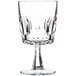 An Arcoroc clear glass wine goblet with a crystal stem.