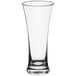 An Acopa flared pilsner glass with a clear bottom and rim.