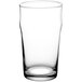 An Acopa English pub glass filled with a clear liquid on a white background.