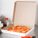 A pepperoni pizza in a Choice customizable pizza box.