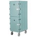 A slate blue Cambro double compartment tray and sheet pan carrier with wheels.