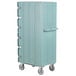 A blue Cambro double compartment tray and sheet pan carrier with wheels and handles.
