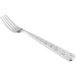 A 10 Strawberry Street Dubai stainless steel dinner fork with a silver handle and a design on it.