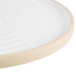 A white Chef & Sommelier dinner plate with a circular rim.