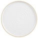 A white Chef & Sommelier dinner plate with a tan circular rim.