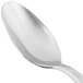 The silver handle of a 10 Strawberry Street stainless steel teaspoon.