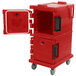 A red plastic Cambro Ultra Camcart food pan carrier with a door open.