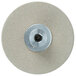 A circular beige grinding wheel with a metal center and a hole in the center.