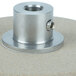An Edlund replacement metal grinding wheel assembly for a knife sharpener on a table.
