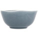 A close-up of an Arcoroc blue porcelain bowl with a wavy edge.