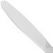 A silver 10 Strawberry Street Lincoln stainless steel dinner knife with a white handle.