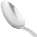 A close-up of a 10 Strawberry Street stainless steel dinner spoon with a gold handle.