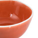 An Arcoroc Canyon Ridge porcelain bowl with a red rim and white base.