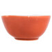 An Arcoroc orange porcelain bowl with a white background.