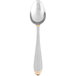 A silver spoon with gold trim and an egg-shaped handle.