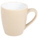 A beige Chef & Sommelier coffee mug with a white handle.