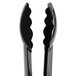 A pair of black Cambro scallop grip tongs.