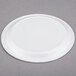 A Solo Symphony white paper plate with a circular rim on a gray surface.