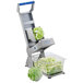An Edlund ARC! XL 1/4" pusher head assembly in a vegetable cutter with a head of lettuce.