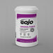 A white container of GOJO Original Pumice Hand Cleaner with a purple label.