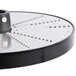 A circular metal Hobart grater plate with holes in it.